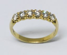 A six stone diamond ring, total approx. diamond wt. 0.42cts, hallmarked 18ct yellow gold band, gross