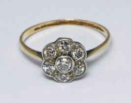 A diamond cluster ring, the flower head cluster measuring approx. 9.5mm in diameter, band