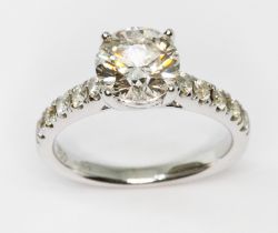 A diamond solitaire ring, the principal four claw set round brilliant cut stone weighing approx. 1.