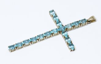 A hallmarked 9ct gold cross set with blue apatite, length 73mm, gross wt. 7g.
