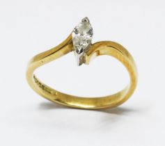 A single stone diamond ring, the marquise cut stone weighing approx. 0.20cts, hallmarked 18ct yellow