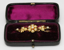 A Victorian seed pearl brooch, unmarked, gross wt. 4.4g, length 42mm, with box. Condition - possible