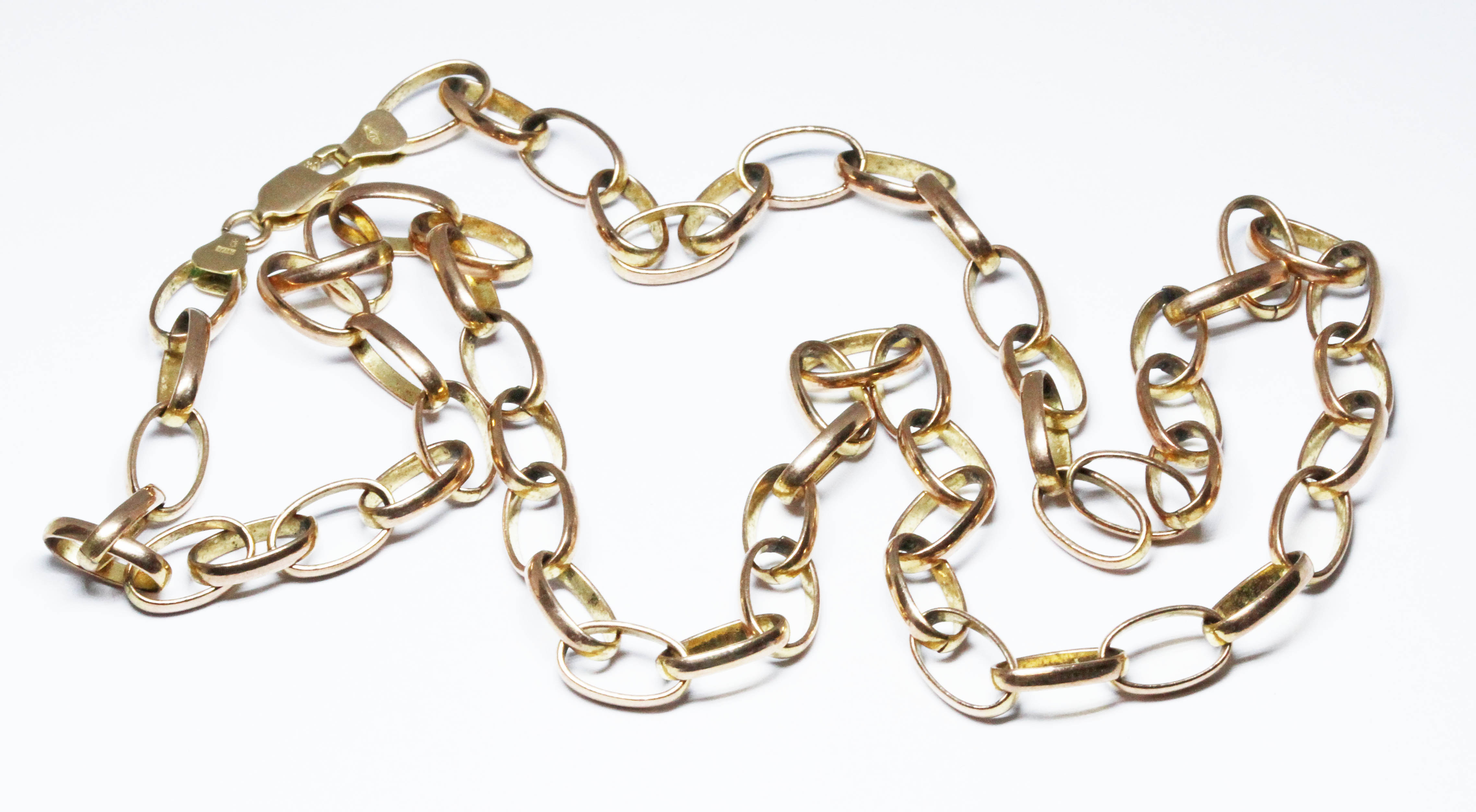 A 9ct gold oval link belcher chain, lobster claw clasp, marked '375' and with 9ct gold import marks,