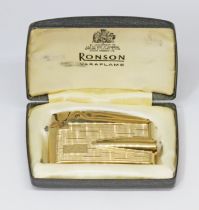 A hallmarked 9ct gold Ronson Varaflame lighter, gross wt. 71.1g, with box.