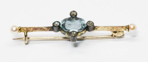 An early 20th century aquamarine, diamond and pearl brooch, the central oval cut aquamarine weighing