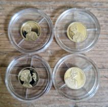 A group of four assorted .585 gold coins comprising of a 1977 silver jubilee, 2002 golden jubilee,