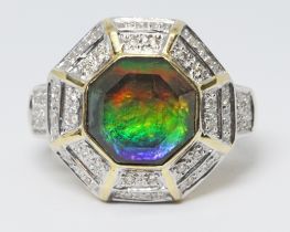 An ammolite and diamond ring, hallmarked 18ct gold, gross wt. 6.4g, size Q. Condition - central