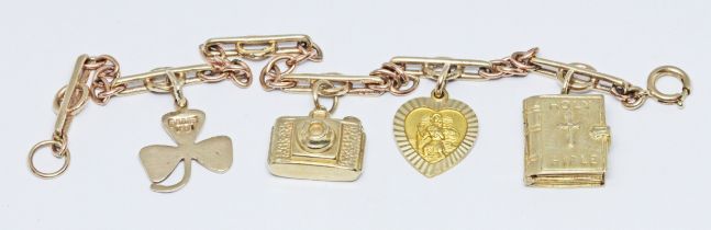 A hallmarked 9ct gold charm bracelet, gross wt. 12.9g, length 18cm. Condition - good, minor wear