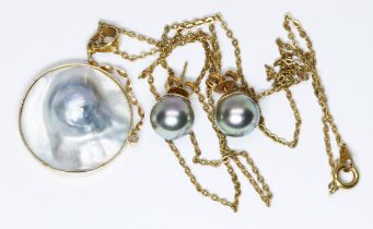 A blister pearl pendant, mount marked '18K', length (including bale) 37mm, and a pair of similar