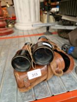 A pair of Hezzanith binoculars with leather case.