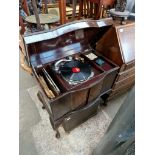 A 1930s Sylvaphone cabinet gramophone together with a case of old gramophone records.