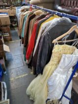 2 racks of mainly sheepskin/suede/leather jackets and coats. Also includes 2 prom/evening dresses