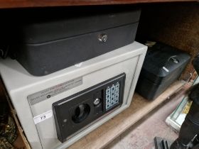 A Digital Safe with key and a Sentry safe with key