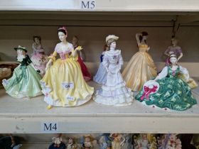 A collection of nine porcelain figures, comprising Coalport, Royal Worcester etc.