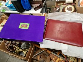 A cased leather bound photograph album