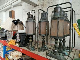 A set of five copper and brass outdoor lights, together with two glass column table lamps