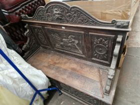 A Victorian carved oak monk's bench, as found.