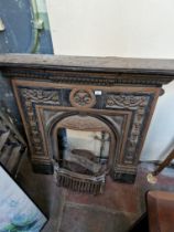 A cast iron fire surround and accessories.