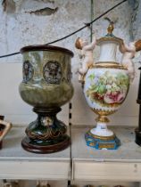 A Royal Doulton Lambeth ware vase together with a continental lidded vase decorated with flowers and