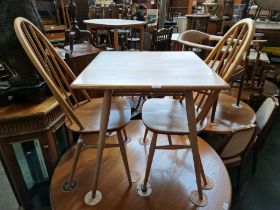 A mid 20th century Ercol light elm breakfast table (model 395) together with two Ercol 'Quaker'