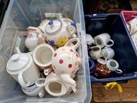 Two plastic crates of teapots - various makers