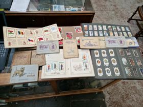 A collection of albums of cigarette cards and a small box of loose Kensitas Silk Flags of the