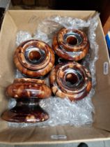 A set of four antique treacle glazed furniture rests.