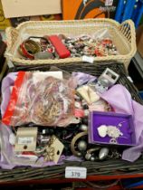 Two baskets of costume jewellery.