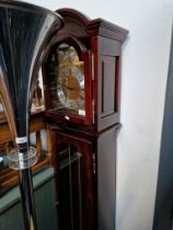 A mahogany cased chiming grandmother clock with brass dial inscribed 'Tempus Fugit'.