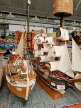 Two wooden model boats; H.M.S. Endeavor and one other.