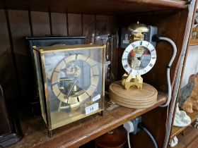 Three clocks, one battery operated, a reproduction Sewills clock under a glass dome and a slate