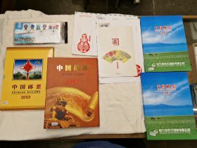 Four stamp albums of Chinese stamps, mostly mint together with some first day covers.
