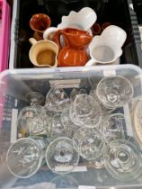 A box of glass trifle dishes and a box of ceramic jugs