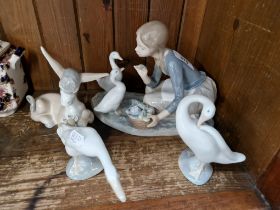 Lladro - 4 items including ‘Food for Ducks’ no.4849, ‘Donkey in Love’ no. 4524 etc.