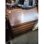 A 1930s oak bureau.