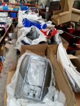 Ten large boxes of various electric motorcycle body parts.