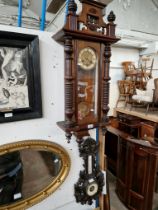 A Vienna wall clock and a carved framed barometer.