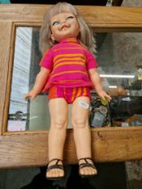 An Ideal Toy Corp. plastic doll "Giggles".