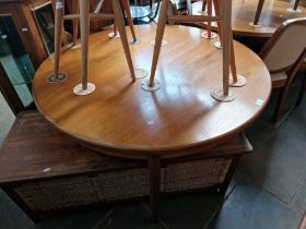 A mid 20th century G Plan teak extending dining table and 6 chairs (2 x carver).