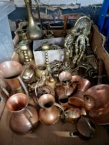 A box of copper and brassware including horse brasses, figures and animals, Indian engraved brass,