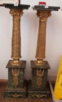 A pair of Egyptian Revival gilt metal and green marble pedestals, height 116.5cm.