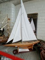 A 1:50 scale model of Endeavour, UK Challenger for Americas Cup 1934. Stands on plinth, total length