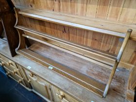 An Ercol elm plate rack.