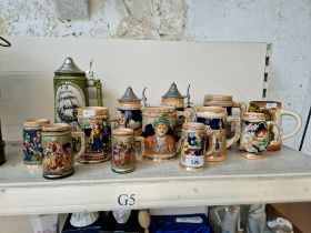 A collection of 13 ceramic steins.