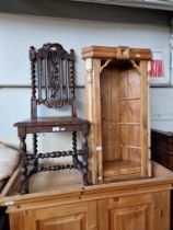 A 19th century carved oak chair together with a pine corner cabinet.