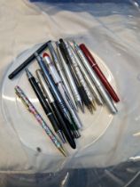 A small collection of fountain and ball point pens including Parker