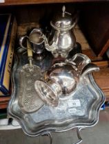Antique and vintage silver plated items on tray.