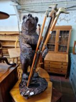 A Black Forest style cast resin stick stand modelled as a bear, height 91cm (approx).