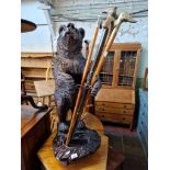 A Black Forest style cast resin stick stand modelled as a bear, height 91cm (approx).