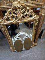A gilt frame mirror and a triple mirror.